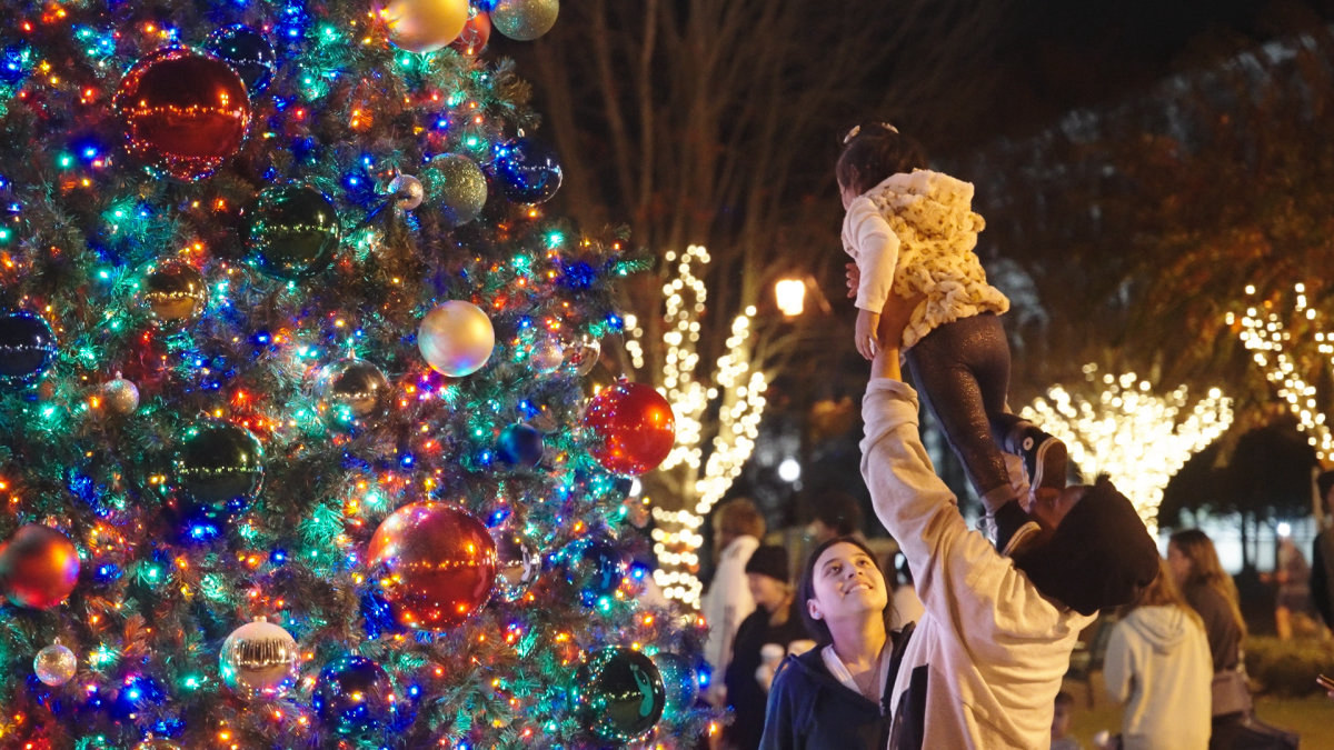 Family At Christmas Tree