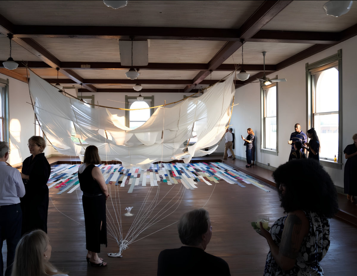 Visitors viewing an art installation in Corsicana, Texas