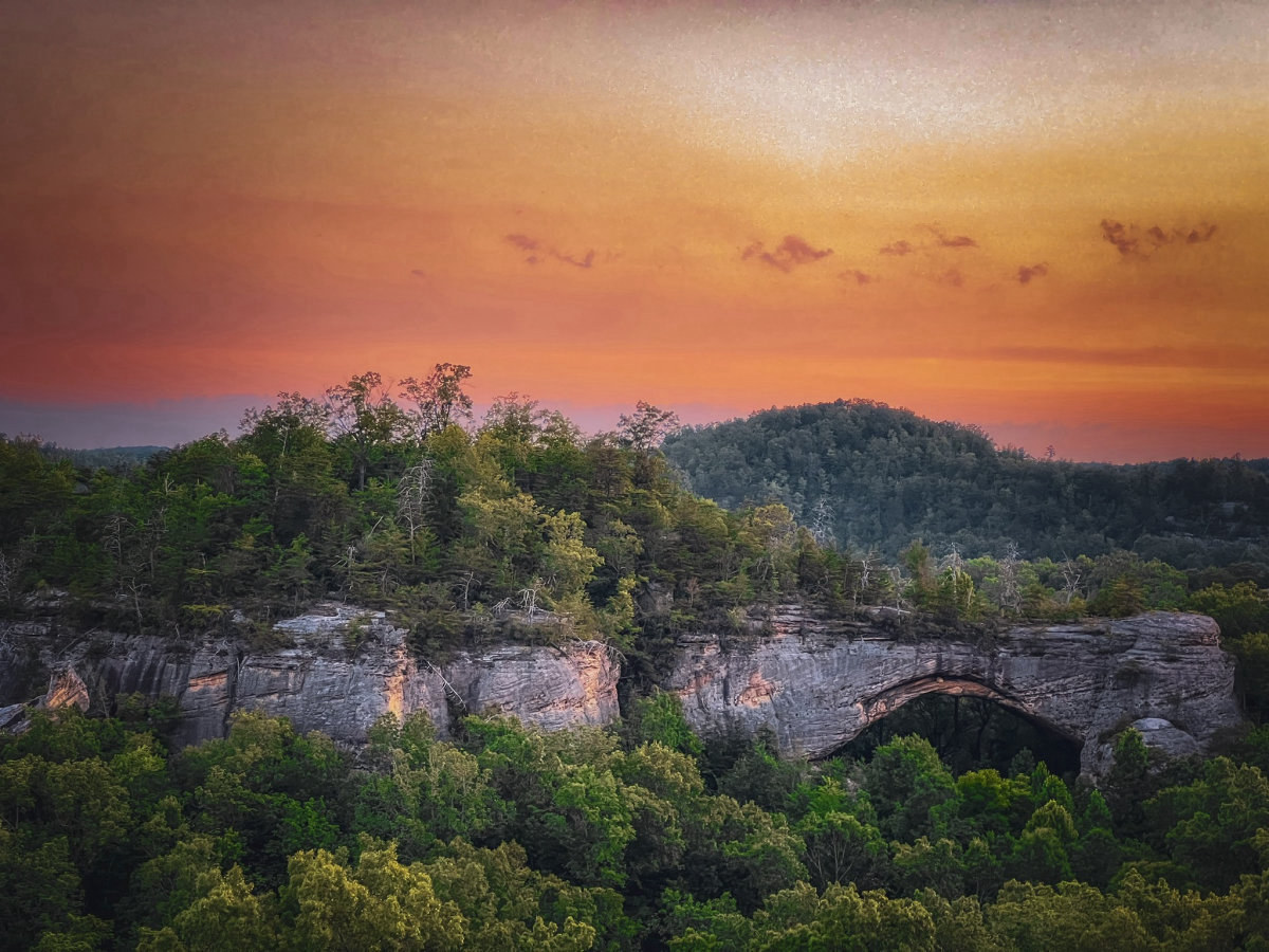 Natural arch above the forest in McCreary County, Kentucky