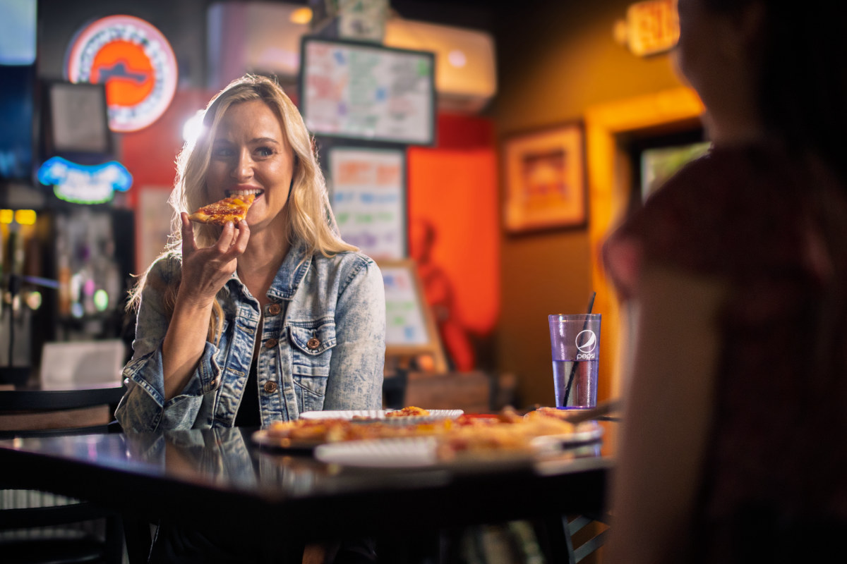 Visitor eating pizza in Morehead, Kentucky