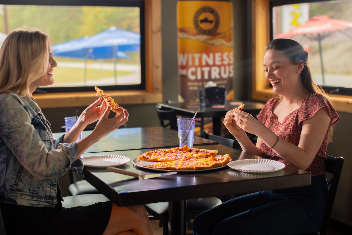 Visitors eating pizza in Morehead, Kentucky